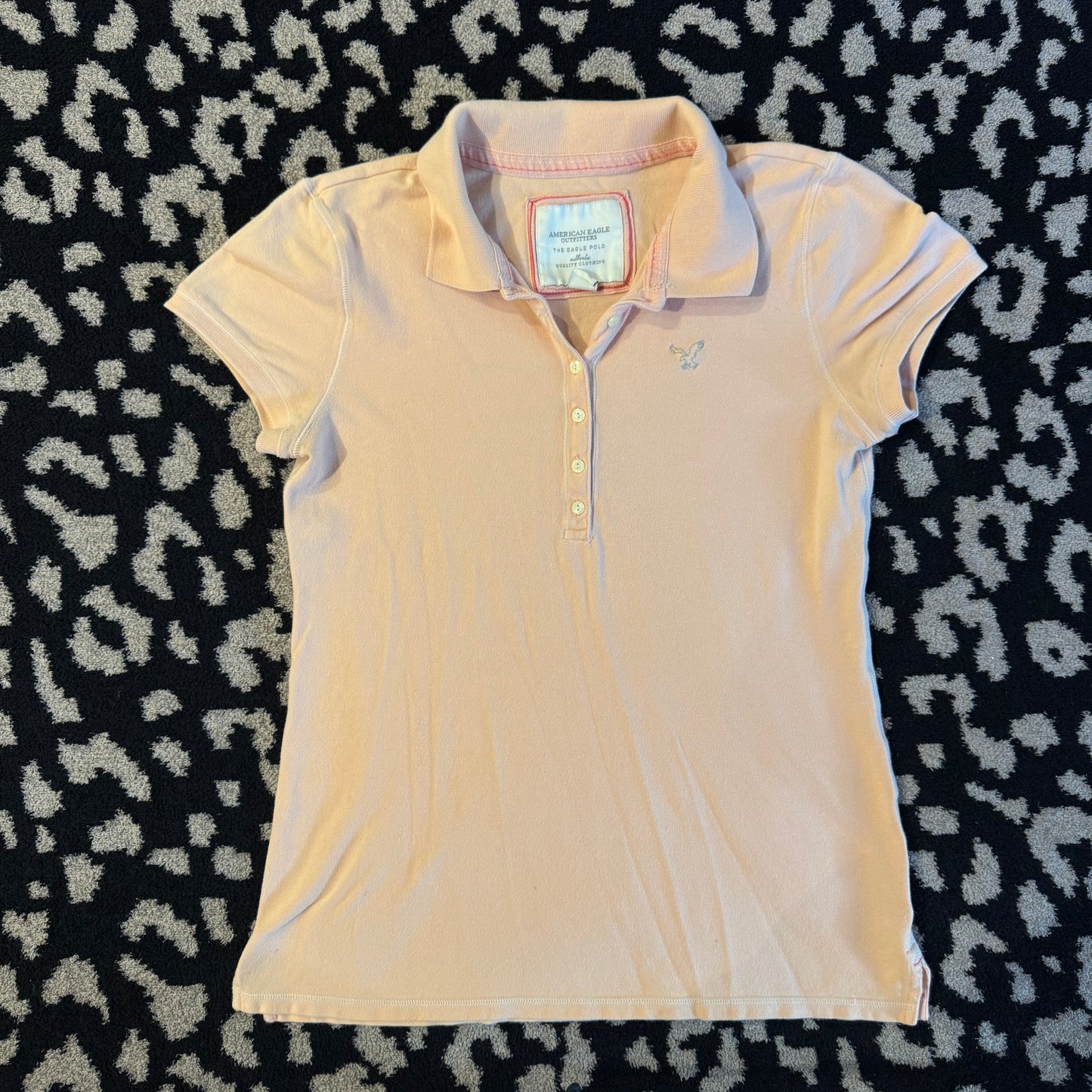 light salmon pink american eagle polo shirt (L)