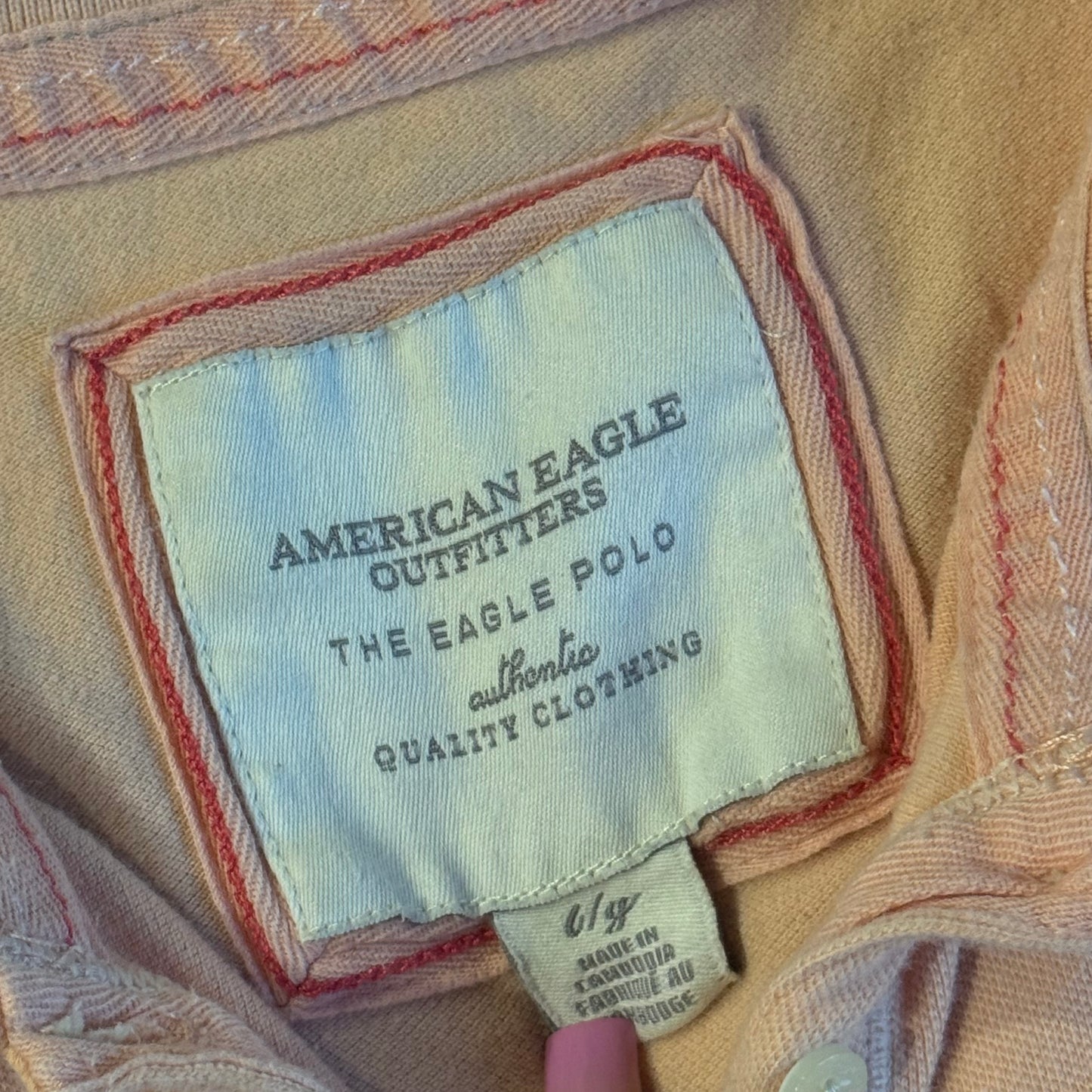 light salmon pink american eagle polo shirt (L)