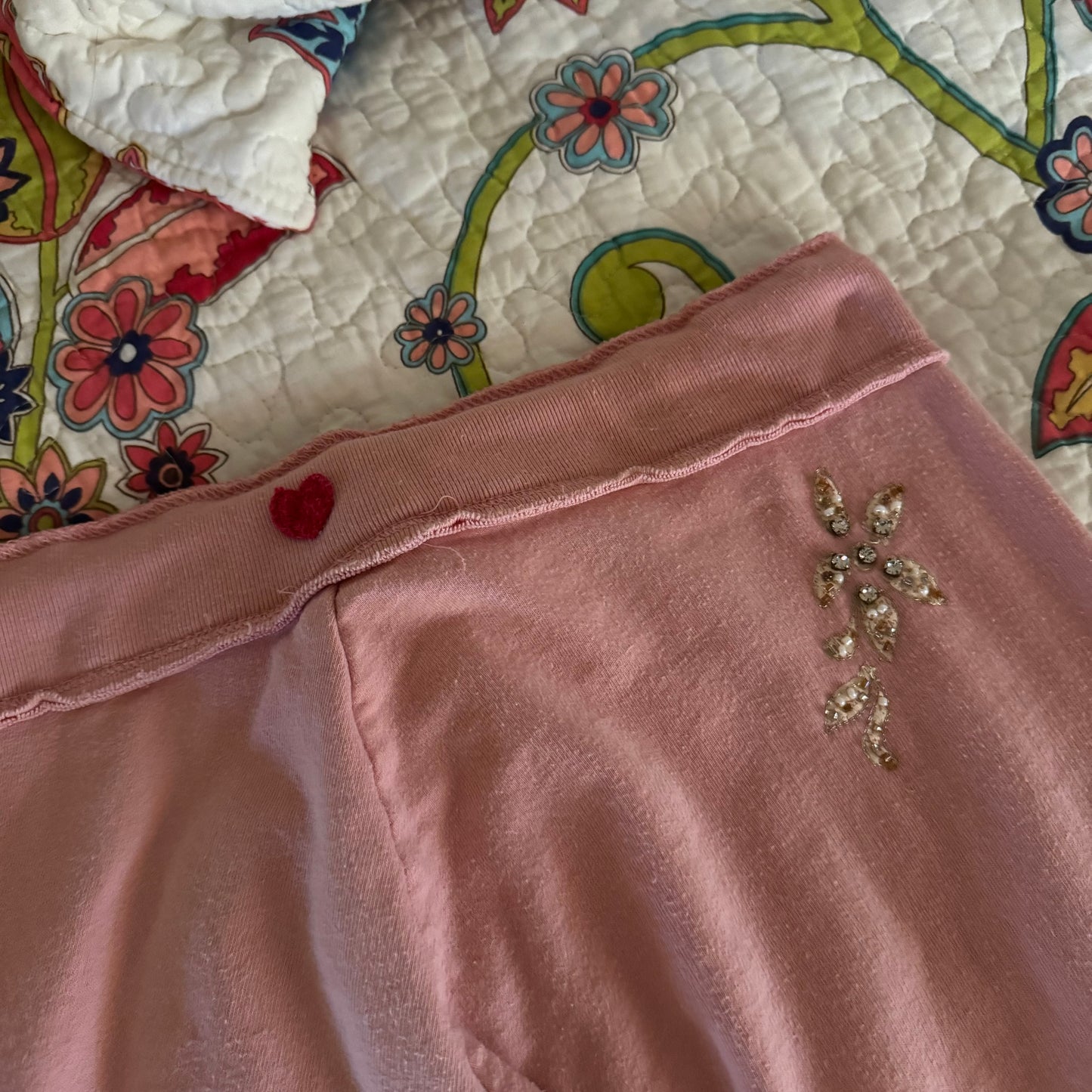 light pink twisted heart rhinestone embellishment low rise flare sweats (S)