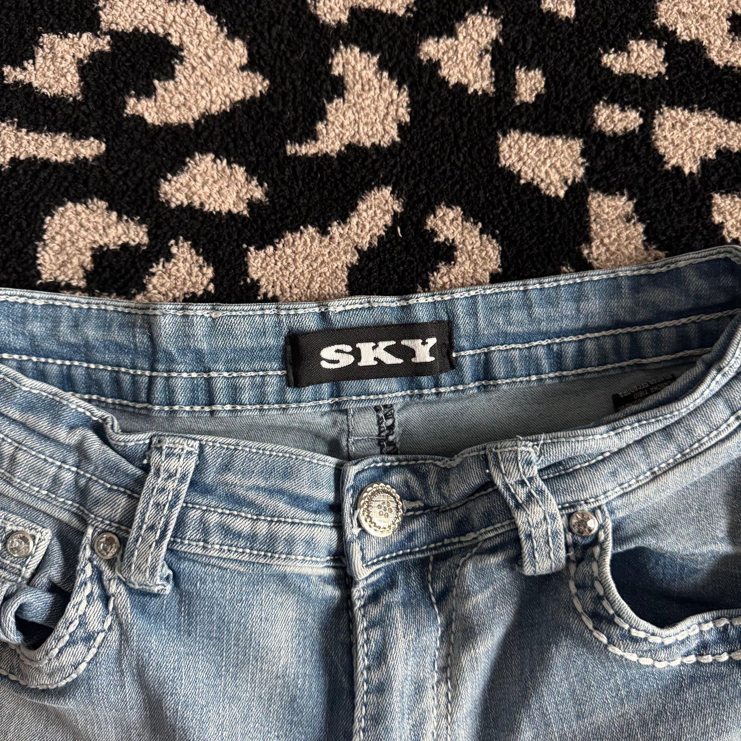denim blue skull rhinestone high rise bootcut jeans (9/10)