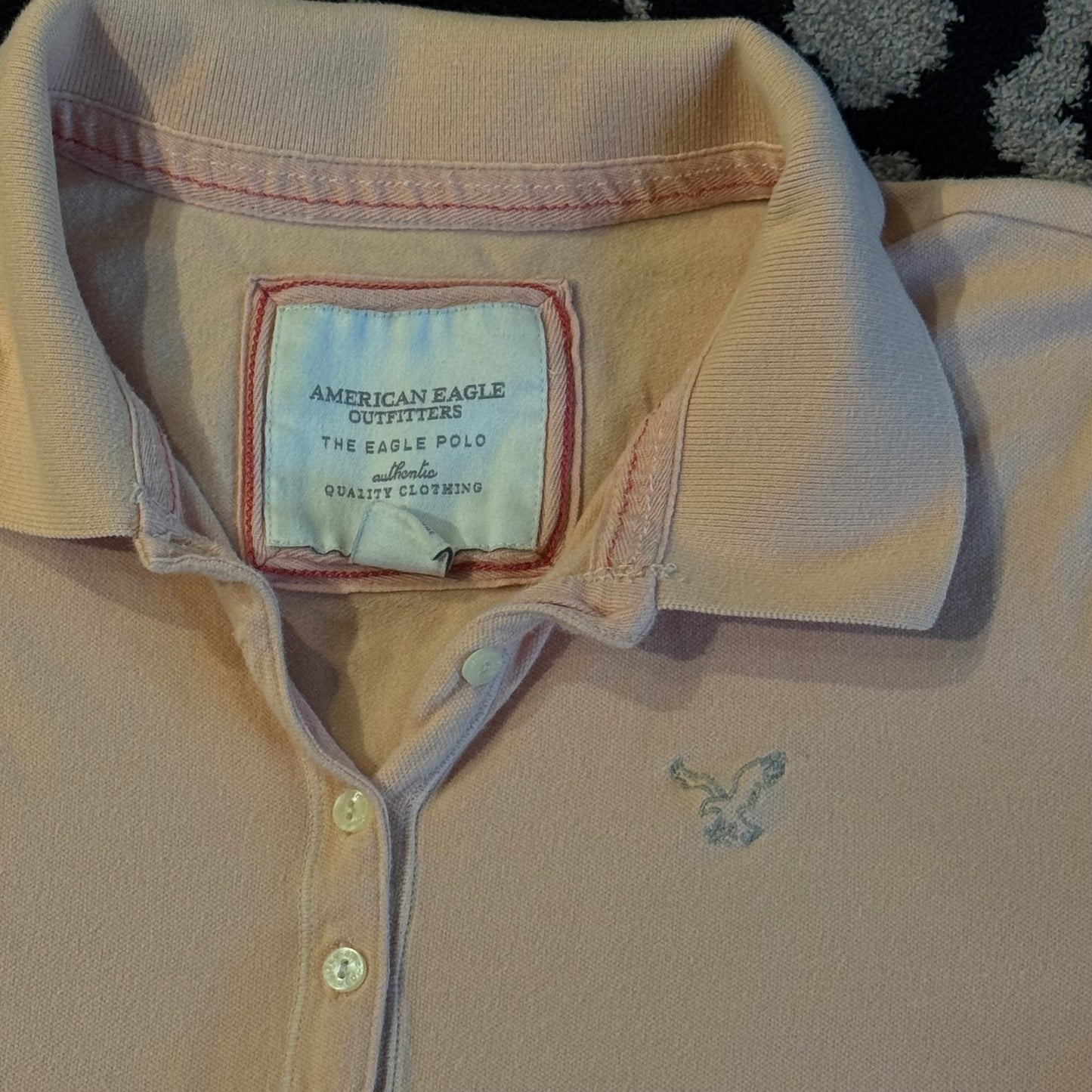 light salmon pink american eagle polo shirt (L)