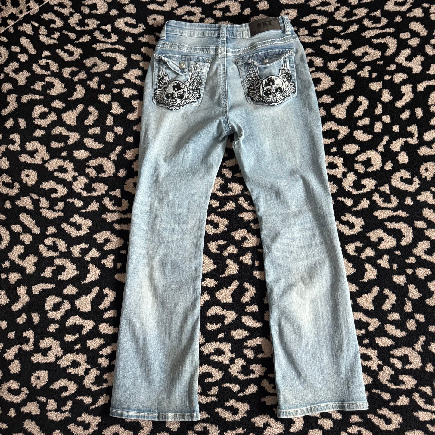 denim blue skull rhinestone high rise bootcut jeans (9/10)
