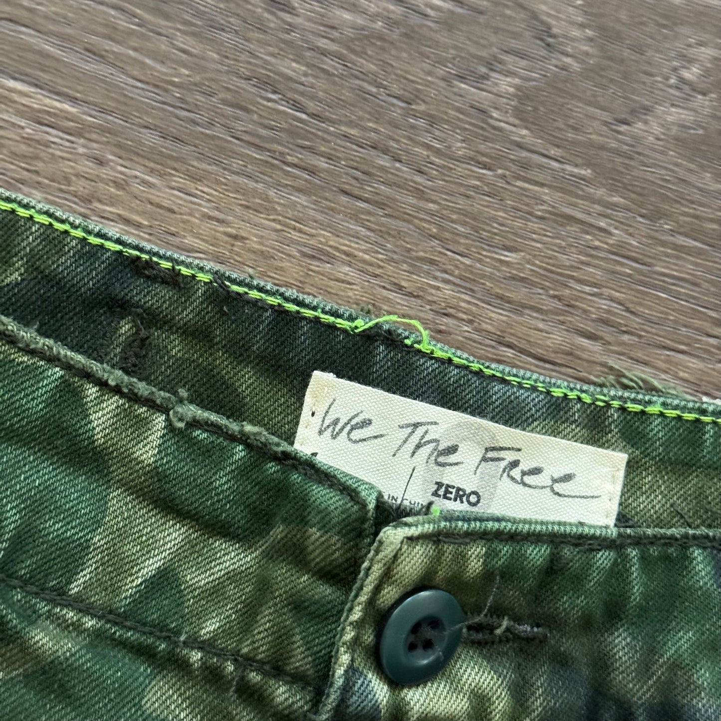 green camo commander distressed shorts